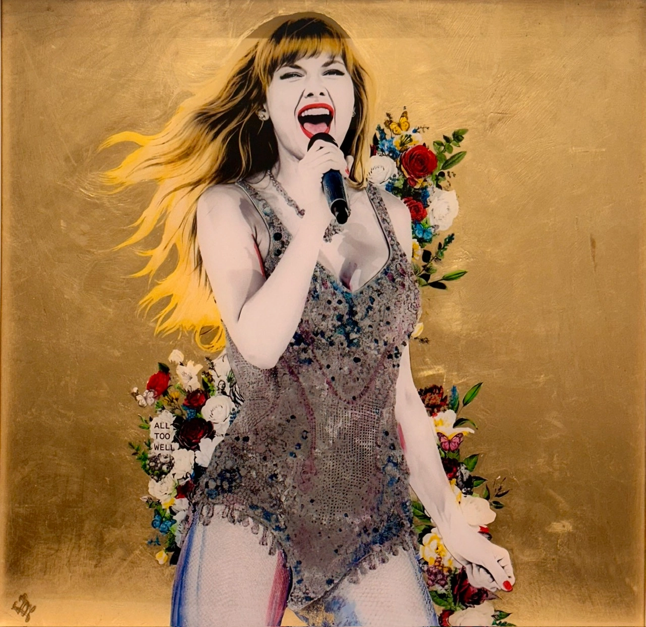 Mixed media painting of a female pop singer performing on stage, holding a microphone with flowing hair, surrounded by floral collage elements and text reading "All Too Well" on a gold leaf background